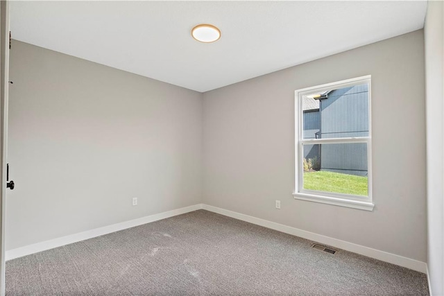 carpeted empty room featuring a healthy amount of sunlight