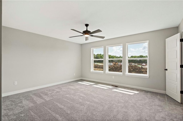 carpeted empty room with ceiling fan