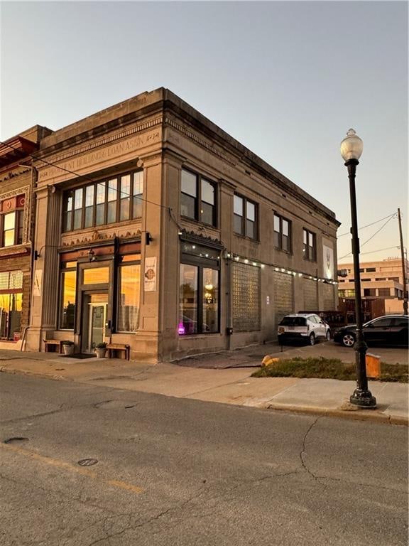 view of outdoor building at dusk