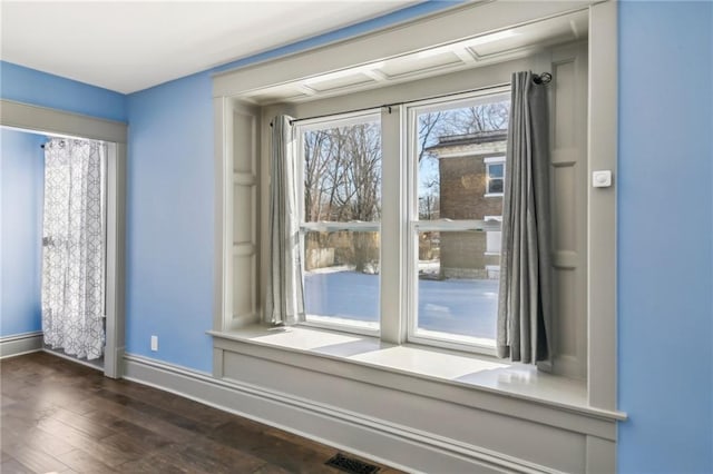 doorway to outside with dark wood-type flooring