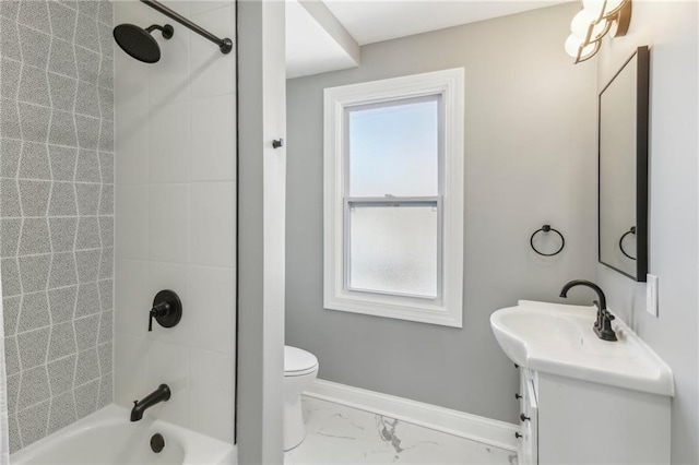 full bathroom featuring toilet, vanity, and tiled shower / bath combo