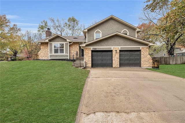 view of front of property featuring a garage and a front lawn