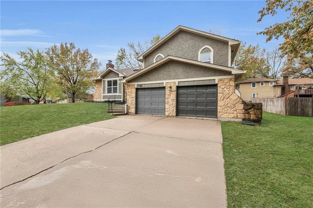 view of front of home with a garage and a front yard