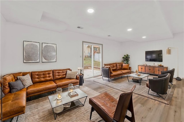 living room with light hardwood / wood-style flooring