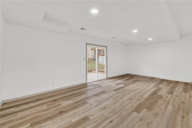 unfurnished room with light hardwood / wood-style floors