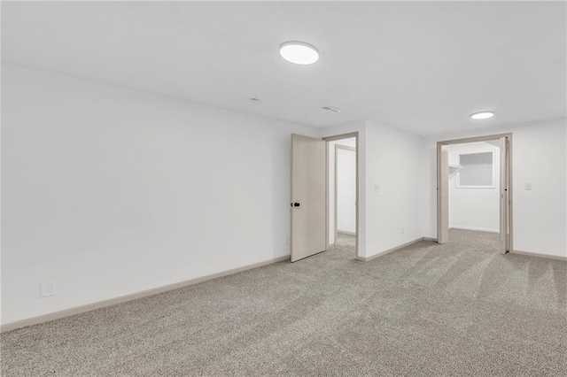 empty room with light colored carpet