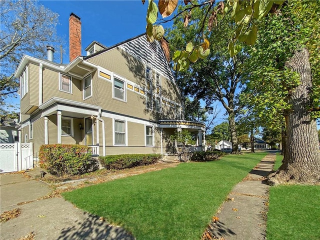 view of home's exterior featuring a lawn