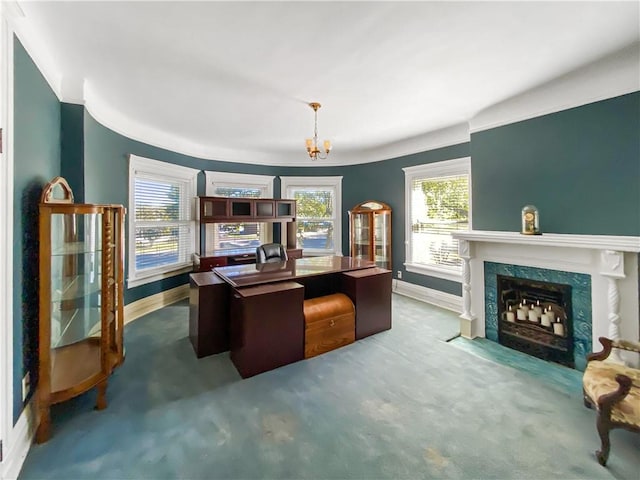 home office with carpet flooring, a fireplace, and an inviting chandelier