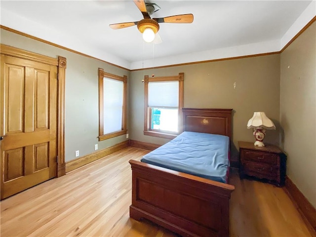 bedroom with ceiling fan and light wood-type flooring