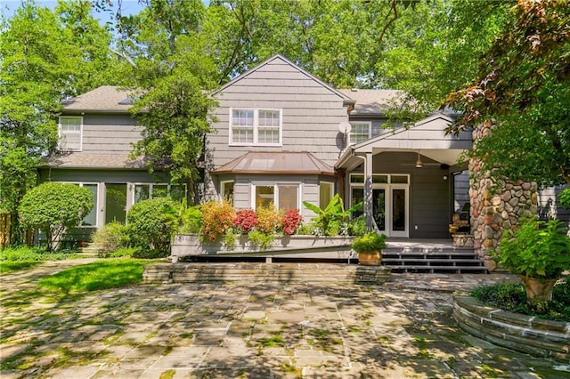 back of house featuring a patio and a deck