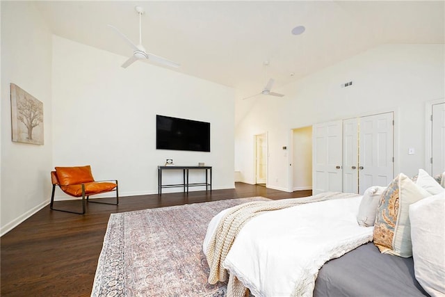 bedroom featuring a closet, ceiling fan, dark hardwood / wood-style flooring, and lofted ceiling