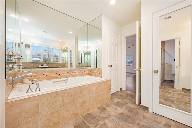 bathroom with tiled tub