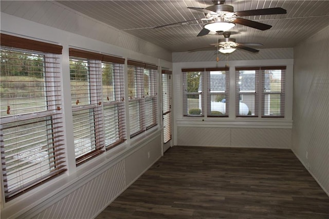 unfurnished sunroom featuring ceiling fan