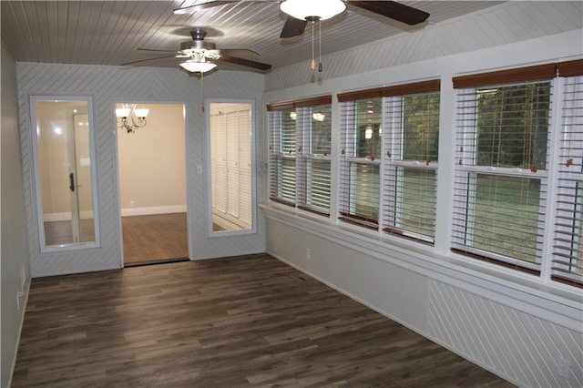 unfurnished sunroom with ceiling fan with notable chandelier