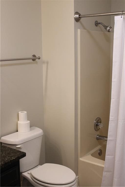 full bathroom with vanity, toilet, and shower / bath combo with shower curtain