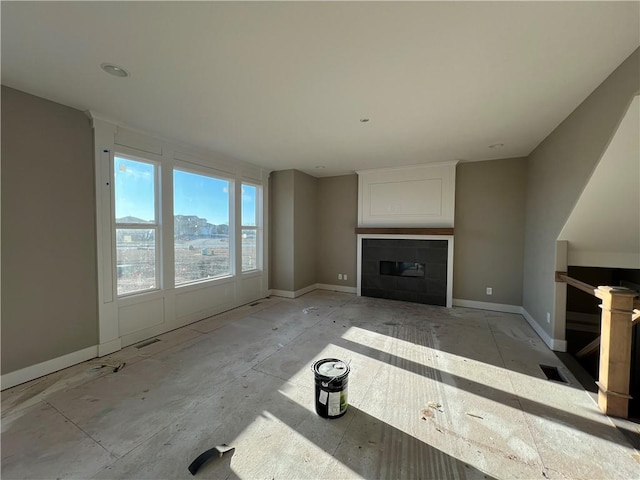 unfurnished living room with a fireplace