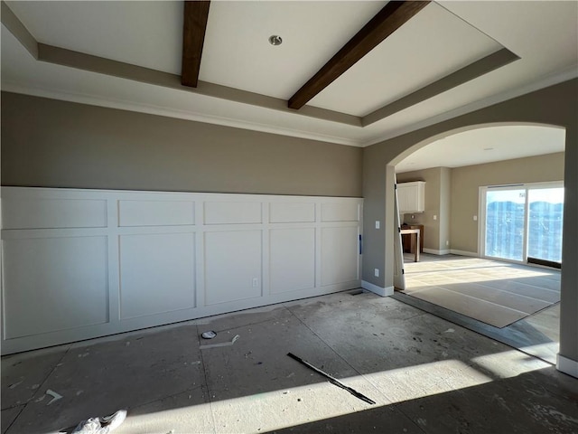 empty room with beamed ceiling