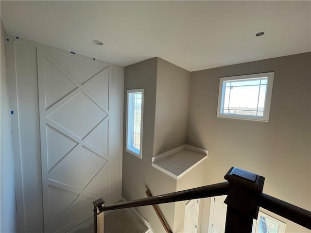 stairway featuring plenty of natural light