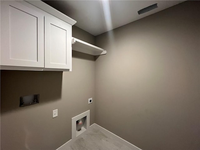 laundry room with cabinets, hookup for an electric dryer, and hookup for a washing machine