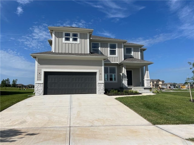28321 W 160th Ct, Gardner, KS 66030 - view of front of house featuring board and batten siding, an attached garage, driveway, and a front yard