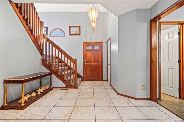 entryway with a notable chandelier