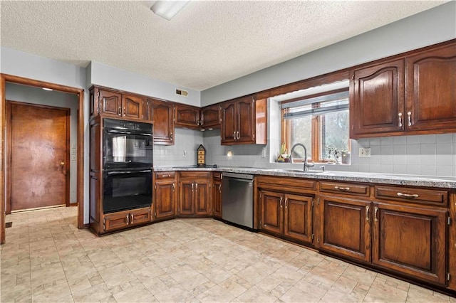 kitchen featuring sink, stainless steel dishwasher, black double oven, a textured ceiling, and decorative backsplash