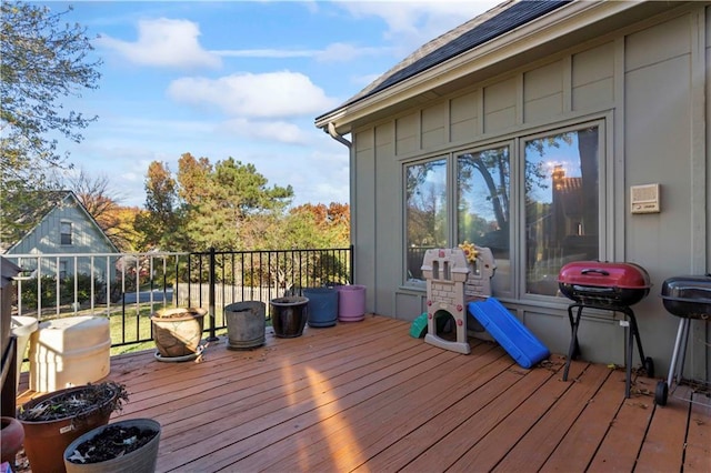 wooden deck featuring grilling area