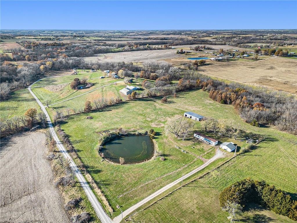 aerial view featuring a rural view and a water view