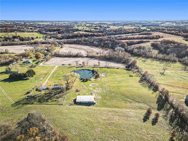 aerial view with a rural view and a water view