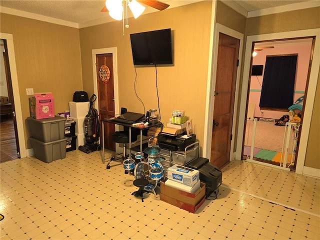 home office with a textured ceiling and ceiling fan