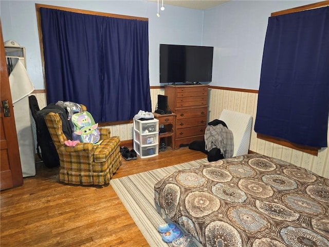 bedroom with hardwood / wood-style flooring