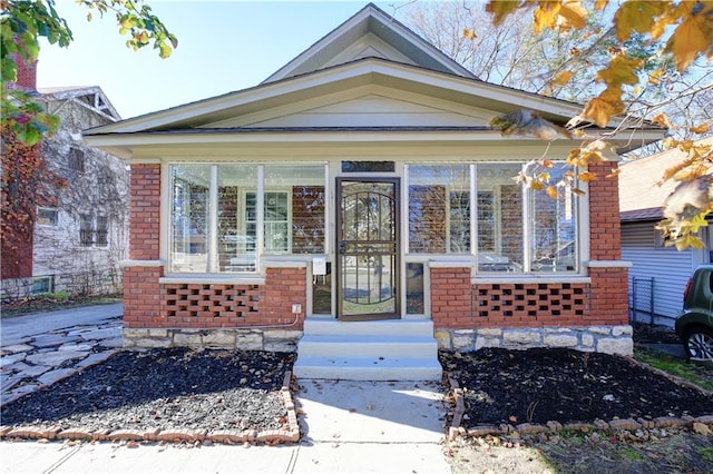 view of front of property with a sunroom