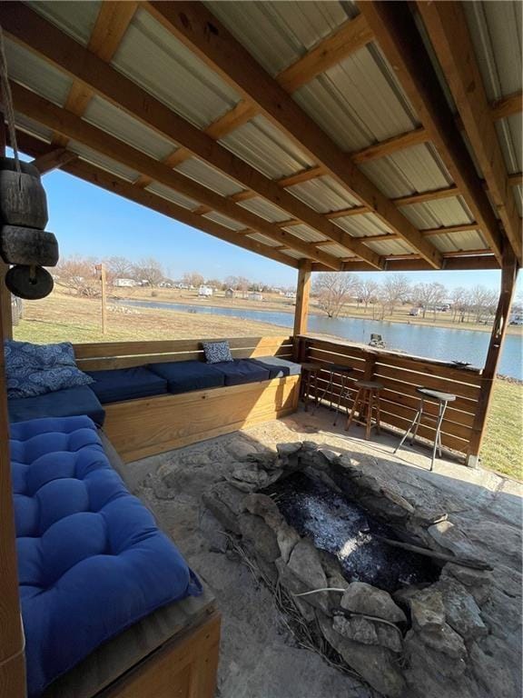 view of patio with a water view