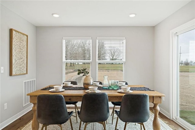 dining room with wood-type flooring