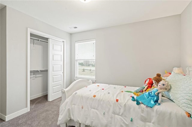 carpeted bedroom featuring a closet