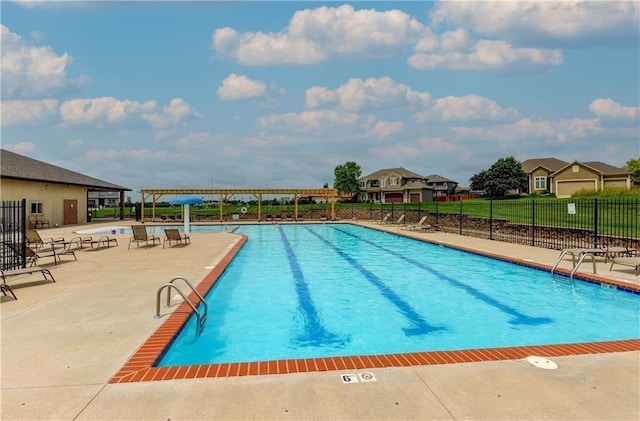 view of swimming pool featuring a patio area