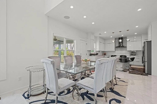 dining room featuring ceiling fan