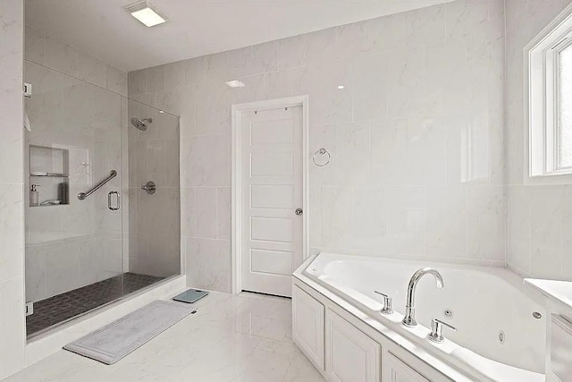 bathroom with plus walk in shower and tile walls