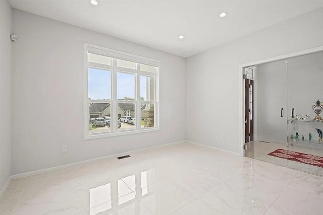 17012 E 38th Ter S, Independence, MO 64055 - spare room featuring marble finish floors and recessed lighting