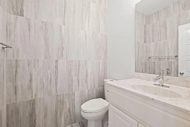 17012 E 38th Ter S, Independence, MO 64055 - bathroom featuring vanity and tile walls