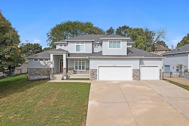17012 E 38th Ter S, Independence, MO 64055 - prairie-style house with stucco siding, stone siding, concrete driveway, and an attached garage