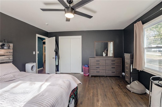 bedroom featuring a closet, ceiling fan, and dark hardwood / wood-style flooring