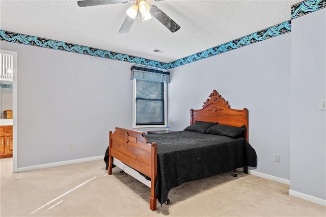 bedroom featuring carpet flooring, a textured ceiling, and baseboards