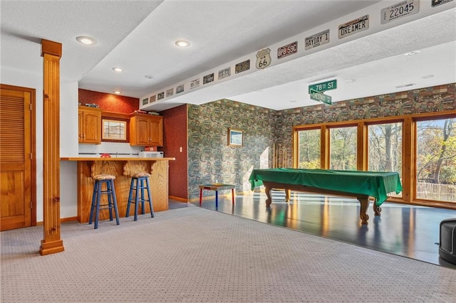 rec room with decorative columns, plenty of natural light, light colored carpet, and billiards