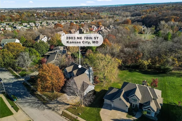 birds eye view of property with a residential view