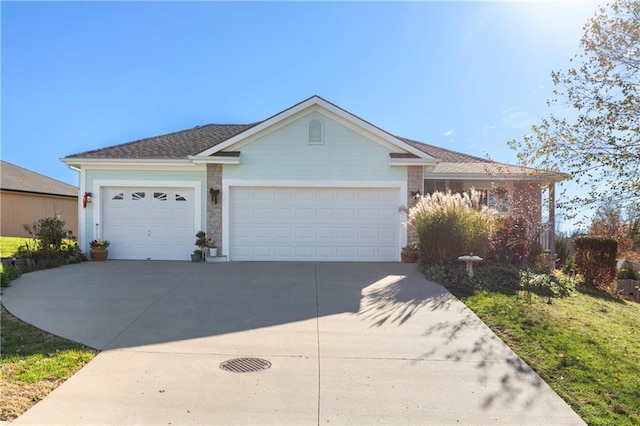 single story home featuring driveway and an attached garage