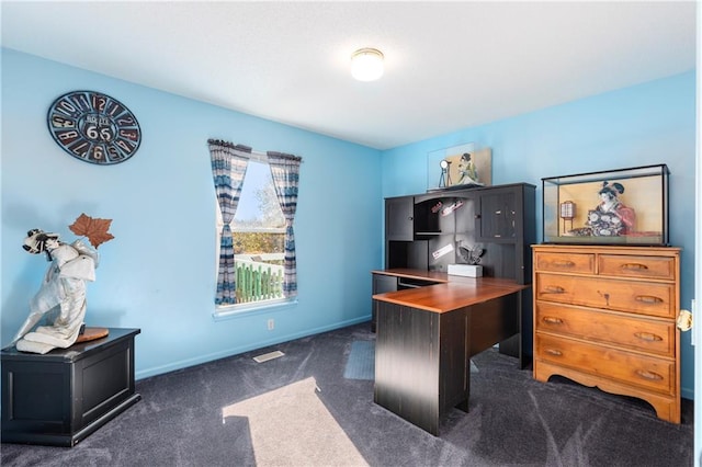 home office featuring dark carpet and baseboards