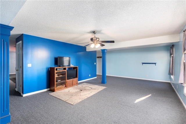 living room with a textured ceiling, baseboards, and carpet flooring