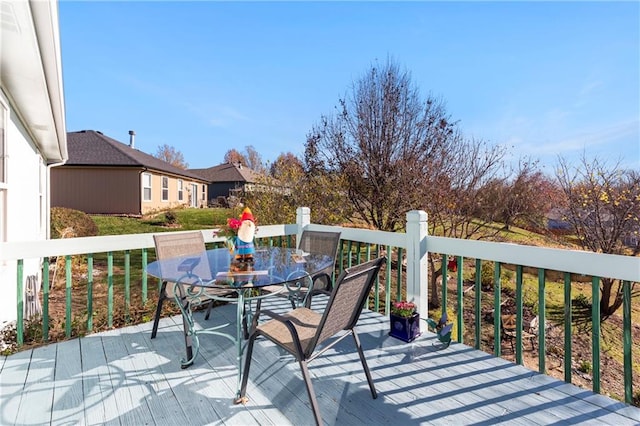 wooden terrace featuring outdoor dining space