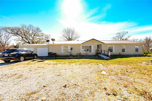 view of front of home with a garage and a front yard